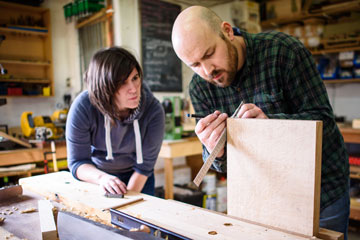 Aidan with cabinet making course student