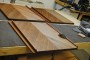 Closer view of the veneered door panel being finished