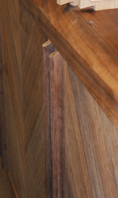 Angled chamfer on door handle ends