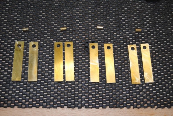 Handmade hinges drilled out for the pivots