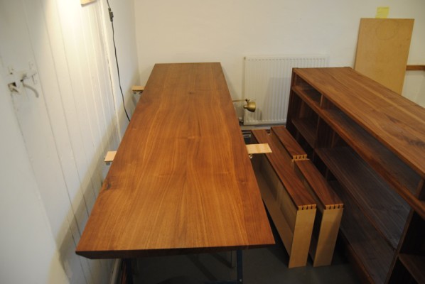 Finished sideboard components in drying room to cure