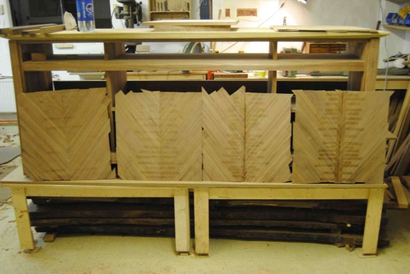 Veneer panels laid out for selection ready to be vacuum bagged