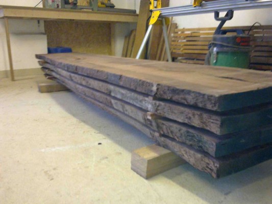 Four plank Walnut log stacked for acclimatization