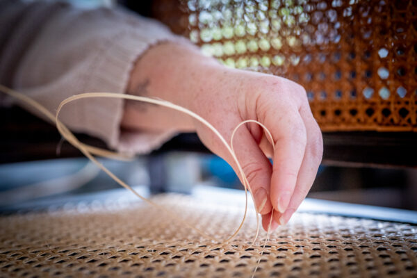 A photo from the chair caning course at Farnham School of Furniture. It shows a chair being caned.